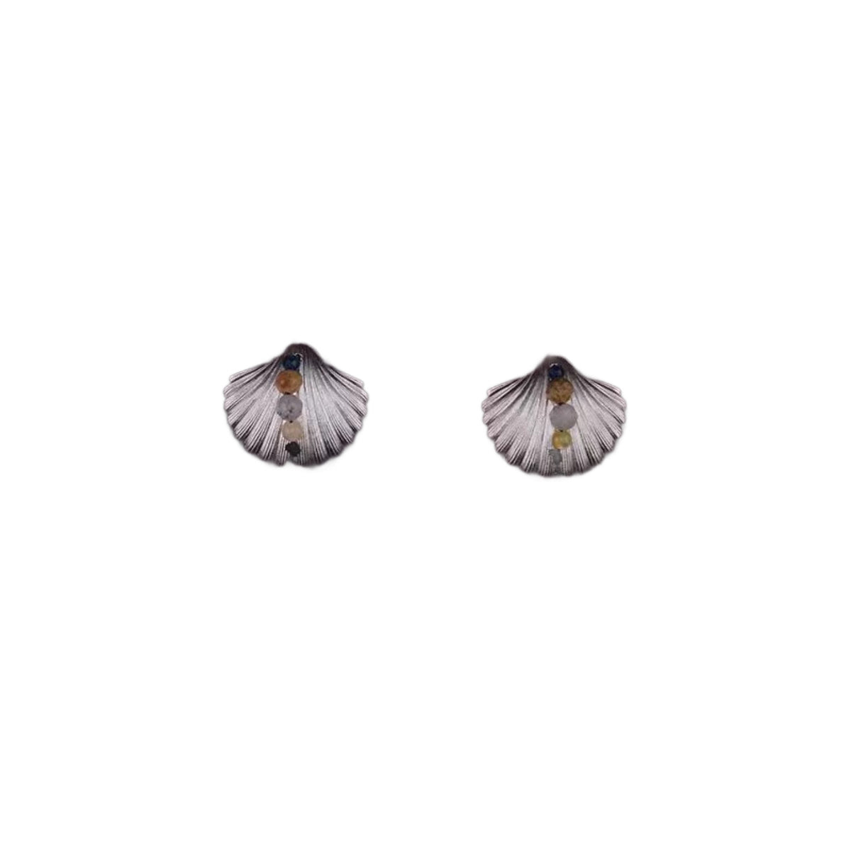 Marina Seashell Stud Earrings styled on the ear with a plain black outfit