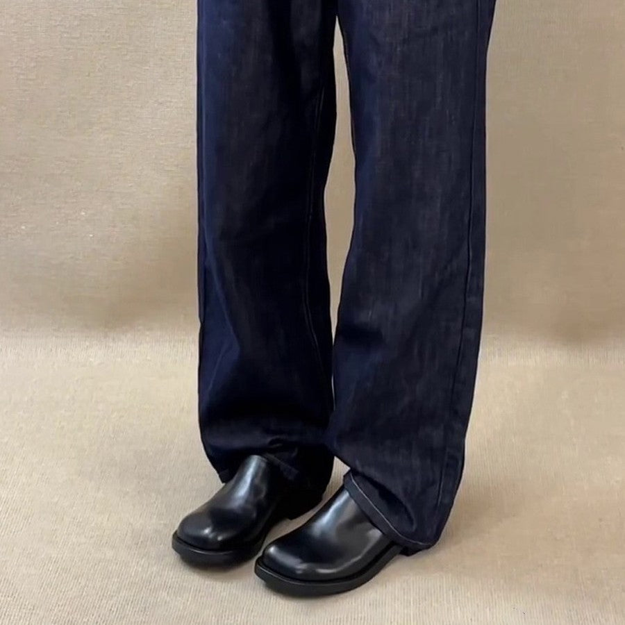 Model wearing Marlowe Square-Toe Mules, standing view showing the block heel